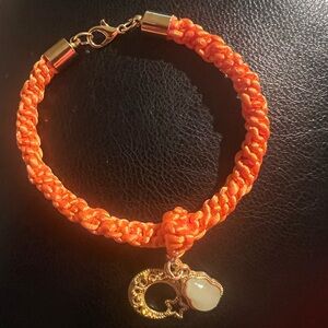 Handmade friendship bracelet with lucky charm